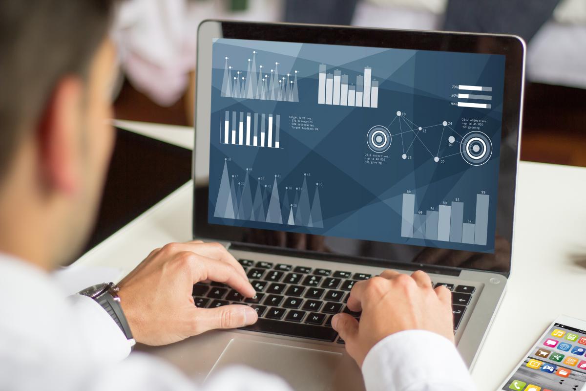 Business owner reviewing an analytics dashboard on a laptop