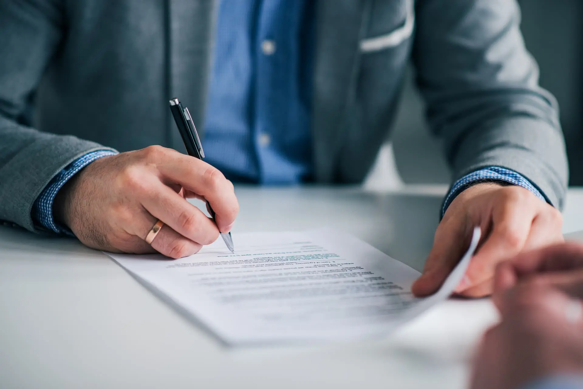 Business partners signing a Korean company agreement