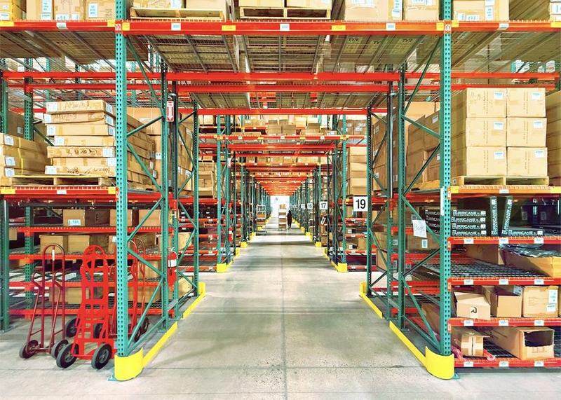 Warehouse aisles stacked with boxed inventory
